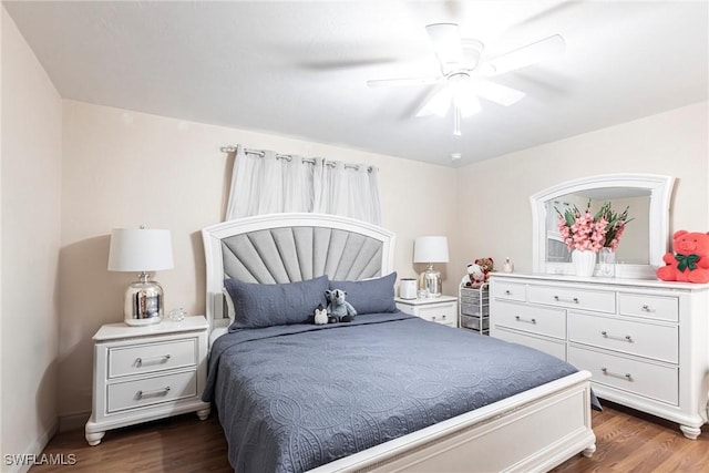 bedroom featuring a ceiling fan and dark wood-style floors