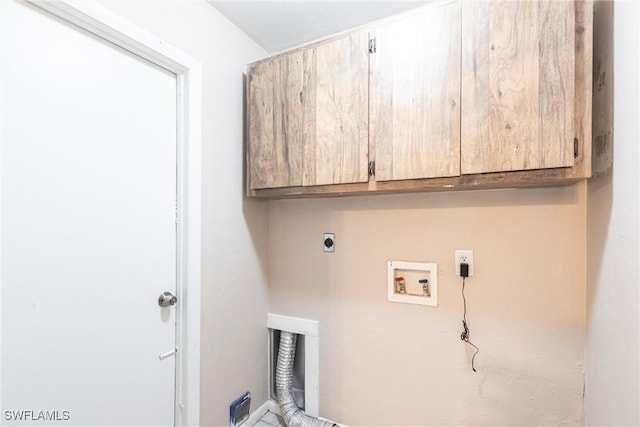 washroom featuring electric dryer hookup, cabinet space, and hookup for a washing machine