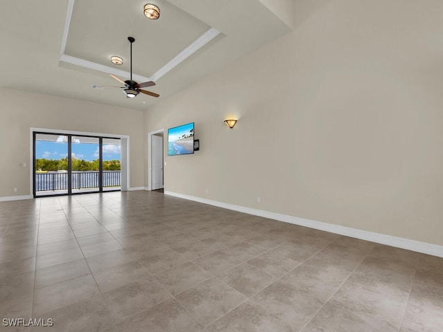 866 Cal Cove Dr, Fort Myers, FL 33919 - tiled empty room featuring a tray ceiling, ceiling fan, and baseboards