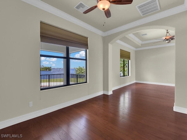 866 Cal Cove Dr, Fort Myers, FL 33919 - empty room featuring ceiling fan, arched walkways, visible vents, wood finished floors, and baseboards