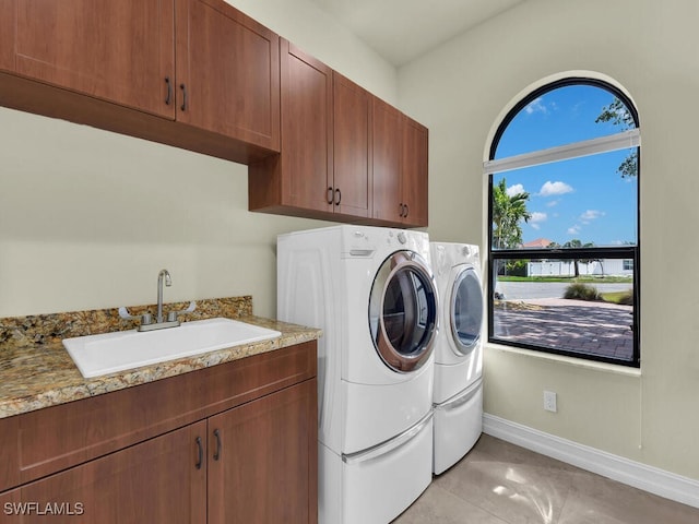 866 Cal Cove Dr, Fort Myers, FL 33919 - laundry area with a sink, baseboards, cabinet space, and separate washer and dryer