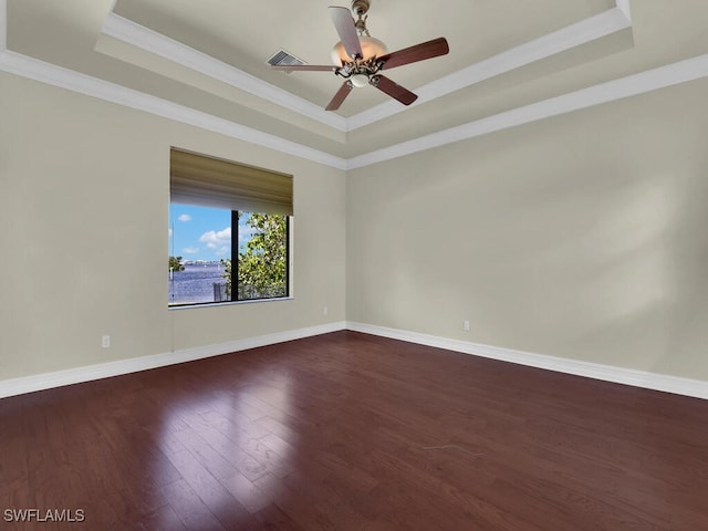 866 Cal Cove Dr, Fort Myers, FL 33919 - unfurnished room featuring baseboards, dark wood-style floors, a tray ceiling, and visible vents