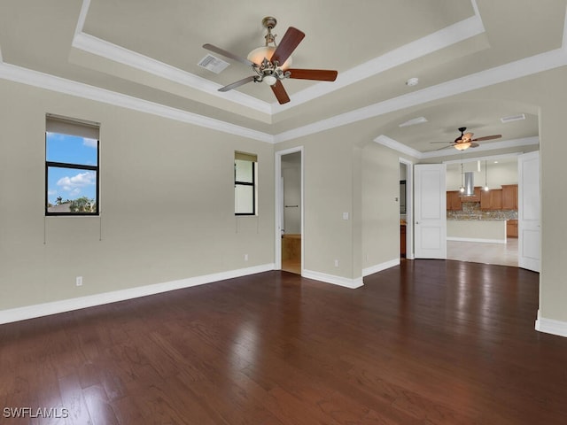 866 Cal Cove Dr, Fort Myers, FL 33919 - empty room with a tray ceiling, wood finished floors, ceiling fan, and visible vents