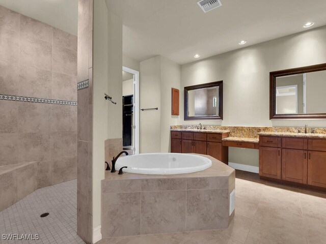 866 Cal Cove Dr, Fort Myers, FL 33919 - full bathroom featuring vanity, tile patterned flooring, walk in shower, a bath, and visible vents