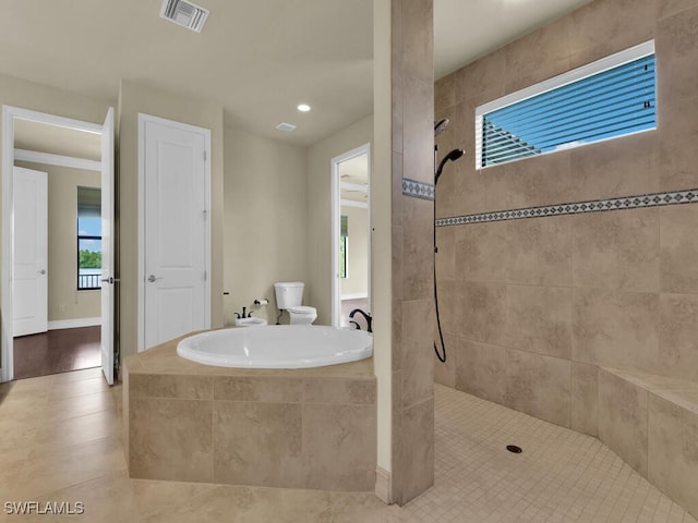866 Cal Cove Dr, Fort Myers, FL 33919 - bathroom featuring a walk in shower, a bath, visible vents, toilet, and tile patterned floors