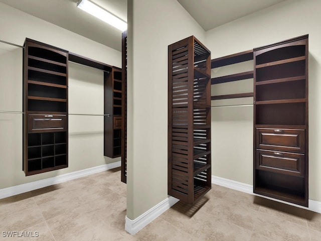 866 Cal Cove Dr, Fort Myers, FL 33919 - spacious closet featuring light tile patterned floors