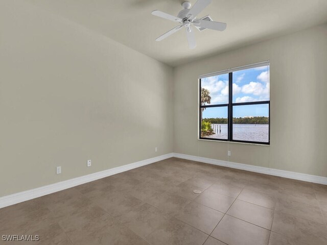 866 Cal Cove Dr, Fort Myers, FL 33919 - tiled empty room with baseboards and a ceiling fan