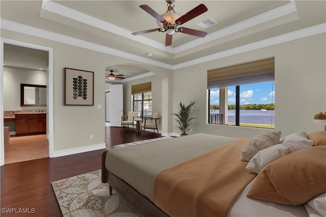 866 Cal Cove Dr, Fort Myers, FL 33919 - bedroom with crown molding, a tray ceiling, visible vents, and wood finished floors