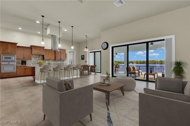 866 Cal Cove Dr, Fort Myers, FL 33919 - living area with recessed lighting, a towering ceiling, visible vents, and baseboards