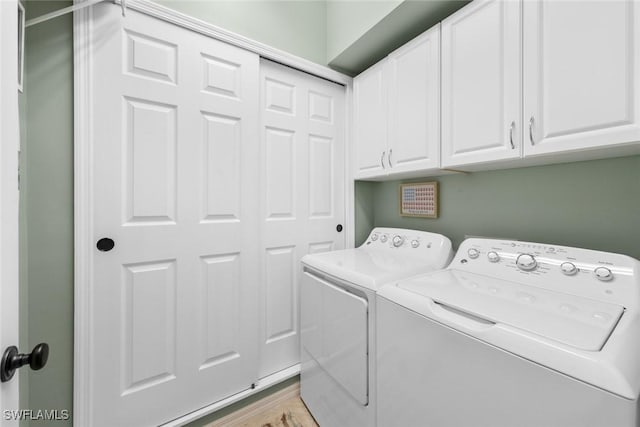 14543 Abaco Lakes Dr Unit 103, Fort Myers, FL 33908 - laundry area featuring cabinet space and independent washer and dryer