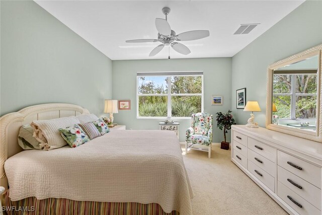 14543 Abaco Lakes Dr Unit 103, Fort Myers, FL 33908 - bedroom with light colored carpet, a ceiling fan, and baseboards