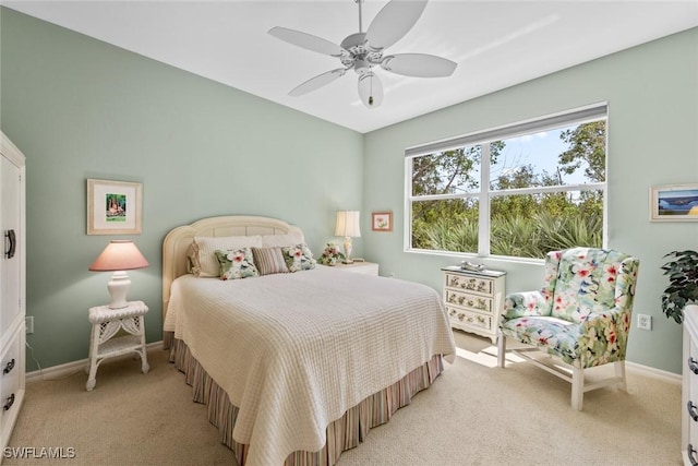 14543 Abaco Lakes Dr Unit 103, Fort Myers, FL 33908 - bedroom featuring light carpet, baseboards, and a ceiling fan