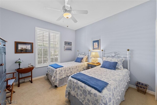 14543 Abaco Lakes Dr Unit 103, Fort Myers, FL 33908 - bedroom with carpet, baseboards, and a ceiling fan