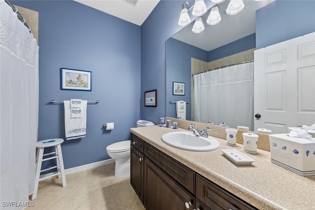 14543 Abaco Lakes Dr Unit 103, Fort Myers, FL 33908 - full bath featuring tile patterned floors, baseboards, toilet, vanity, and a chandelier