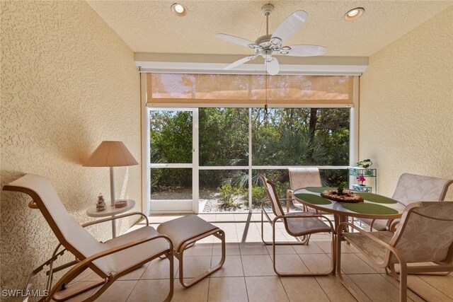 14543 Abaco Lakes Dr Unit 103, Fort Myers, FL 33908 - sunroom / solarium featuring a textured wall, a textured ceiling, and tile patterned floors