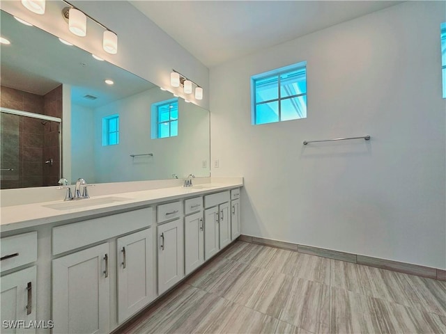26330 Coco Cay Cir Unit 201, Bonita Springs, FL 34135 - full bath with double vanity, a tile shower, and recessed lighting