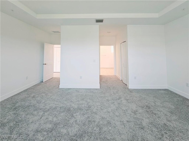 26330 Coco Cay Cir Unit 201, Bonita Springs, FL 34135 - empty room with carpet flooring and a raised ceiling