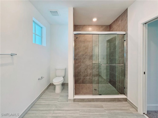 26330 Coco Cay Cir Unit 201, Bonita Springs, FL 34135 - full bathroom featuring toilet and a shower stall