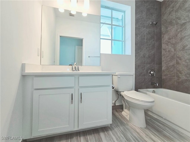 26330 Coco Cay Cir Unit 201, Bonita Springs, FL 34135 - full bath featuring vanity, shower / washtub combination, and wood finished floors