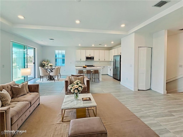 26330 Coco Cay Cir Unit 201, Bonita Springs, FL 34135 - living room featuring recessed lighting and light tile patterned flooring