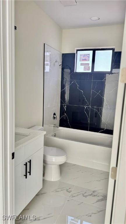 4802 Nora Ave N, Lehigh Acres, FL 33971 - full bath with vanity, shower / bathtub combination, and marble finish flooring