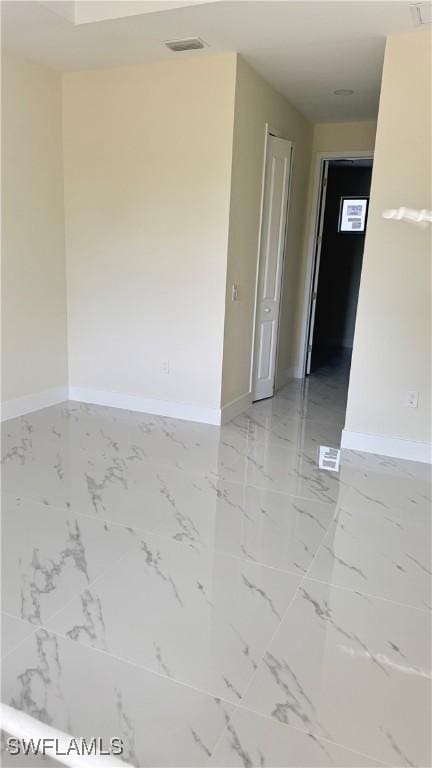 4802 Nora Ave N, Lehigh Acres, FL 33971 - spare room with light marble finish flooring