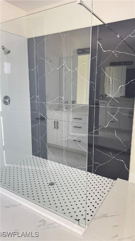 4802 Nora Ave N, Lehigh Acres, FL 33971 - full bathroom featuring a marble finish shower and marble finish floors