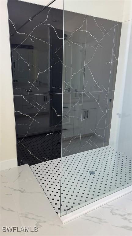 4802 Nora Ave N, Lehigh Acres, FL 33971 - full bathroom featuring marble finish flooring and a marble finish shower