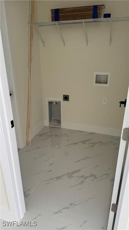 4802 Nora Ave N, Lehigh Acres, FL 33971 - laundry area featuring washer hookup, light marble finish flooring, and electric dryer hookup