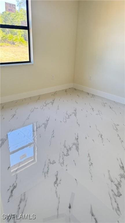4802 Nora Ave N, Lehigh Acres, FL 33971 - spare room with marble finish floors