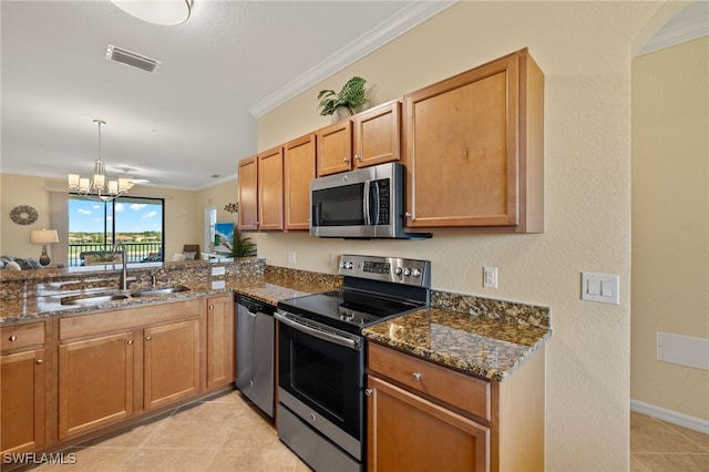 17991 Bonita National Blvd Unit 843, Bonita Springs, FL 34135 - kitchen with appliances with stainless steel finishes, a sink, crown molding, dark stone countertops, and a chandelier