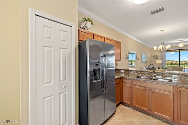 17991 Bonita National Blvd Unit 843, Bonita Springs, FL 34135 - kitchen with stainless steel fridge, a sink, crown molding, brown cabinets, and a chandelier