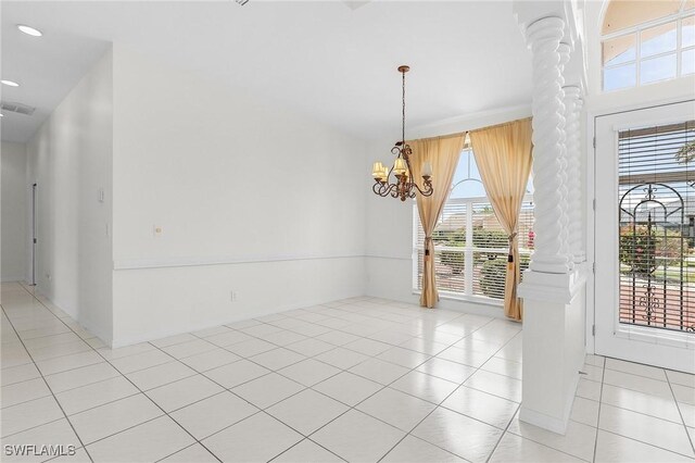 1207 SW 52nd Ter, Cape Coral, FL 33914 - empty room featuring decorative columns, light tile patterned floors, plenty of natural light, a chandelier, and recessed lighting
