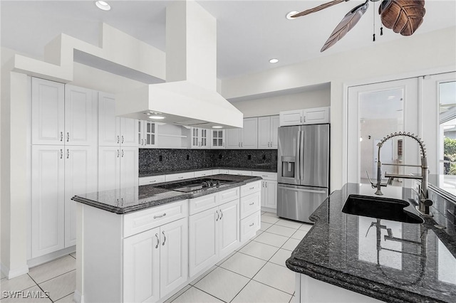 1207 SW 52nd Ter, Cape Coral, FL 33914 - kitchen featuring stainless steel refrigerator with ice dispenser, a sink, black electric stovetop, a center island, and island range hood