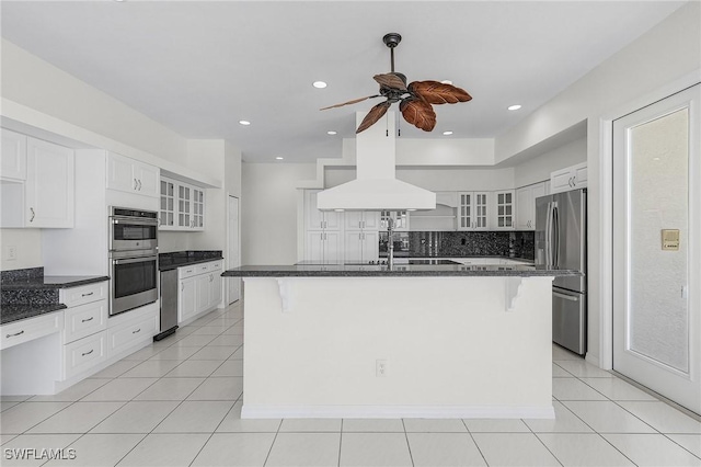 1207 SW 52nd Ter, Cape Coral, FL 33914 - kitchen with appliances with stainless steel finishes, a ceiling fan, glass insert cabinets, a kitchen breakfast bar, and recessed lighting