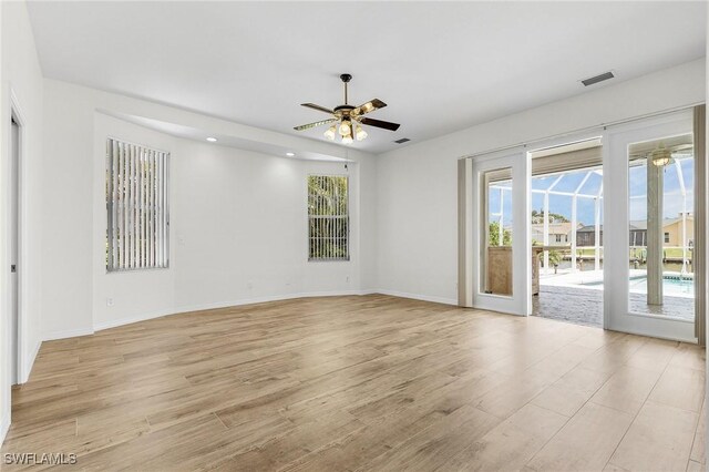 1207 SW 52nd Ter, Cape Coral, FL 33914 - empty room with a ceiling fan, light wood-style floors, baseboards, and recessed lighting