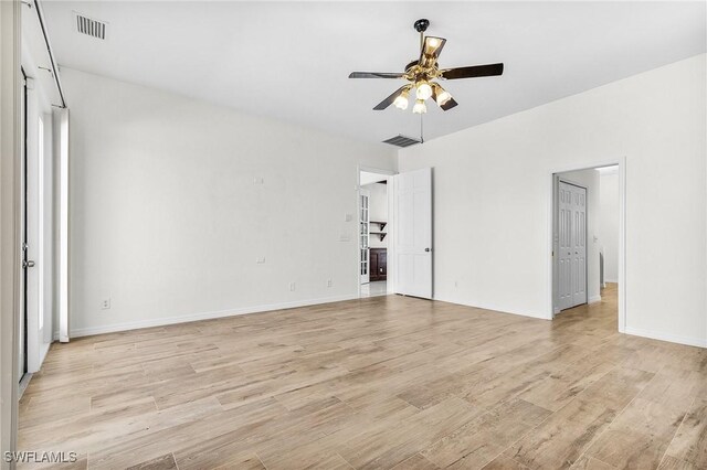 1207 SW 52nd Ter, Cape Coral, FL 33914 - spare room featuring ceiling fan, light wood finished floors, and baseboards