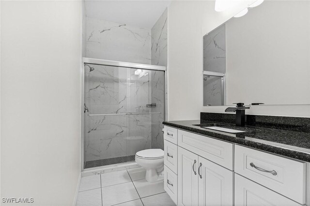 1207 SW 52nd Ter, Cape Coral, FL 33914 - bathroom featuring toilet, vanity, and a marble finish shower