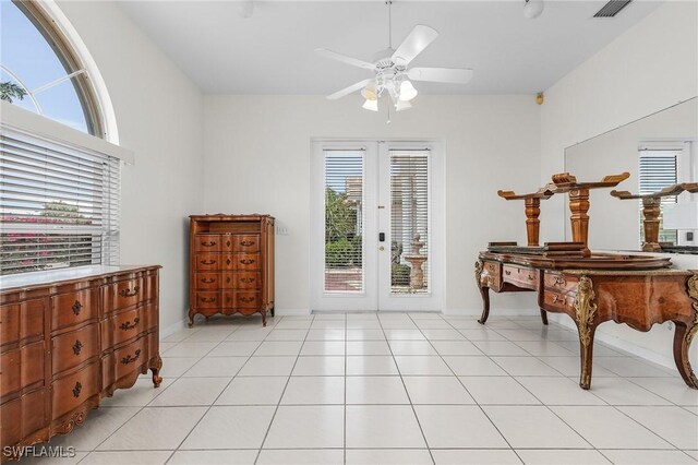 1207 SW 52nd Ter, Cape Coral, FL 33914 - entryway with ceiling fan, french doors, baseboards, and light tile patterned floors