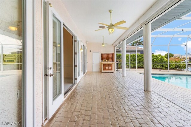 1207 SW 52nd Ter, Cape Coral, FL 33914 - swimming pool featuring a ceiling fan, french doors, a lanai, and a patio