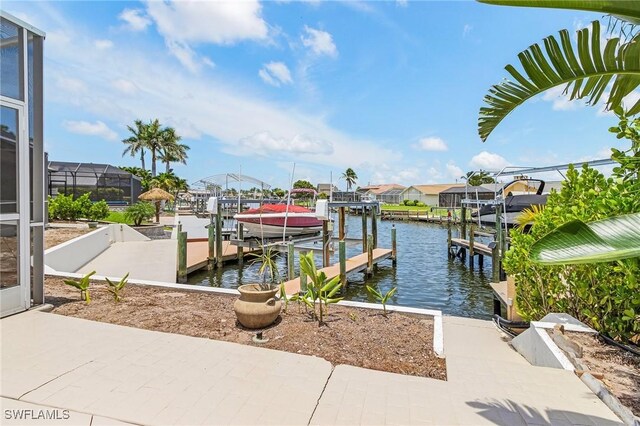 1207 SW 52nd Ter, Cape Coral, FL 33914 - dock area with boat lift and a water view