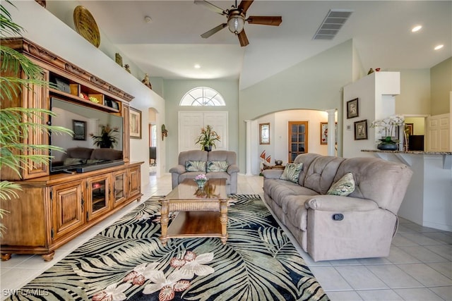 3914 SW 17th Ave, Cape Coral, FL 33914 - living room featuring light tile patterned floors, visible vents, arched walkways, and ceiling fan
