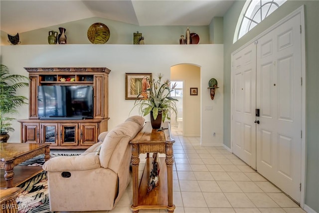 3914 SW 17th Ave, Cape Coral, FL 33914 - foyer with light tile patterned flooring, arched walkways, plenty of natural light, and vaulted ceiling