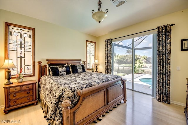 3914 SW 17th Ave, Cape Coral, FL 33914 - bedroom featuring light wood-style flooring, baseboards, access to exterior, and visible vents