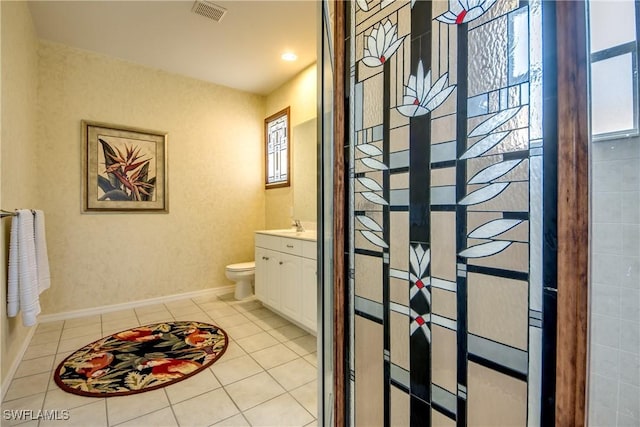 3914 SW 17th Ave, Cape Coral, FL 33914 - bathroom featuring visible vents, baseboards, toilet, vanity, and tile patterned flooring