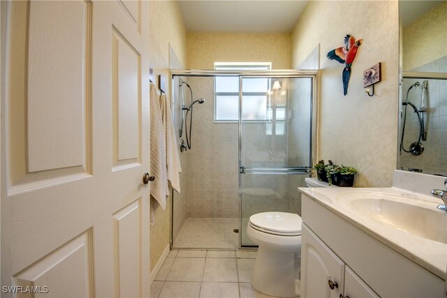 3914 SW 17th Ave, Cape Coral, FL 33914 - bathroom with toilet, a stall shower, tile patterned flooring, and vanity