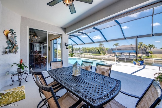 3914 SW 17th Ave, Cape Coral, FL 33914 - view of patio with glass enclosure, outdoor dining space, an outdoor pool, and a ceiling fan