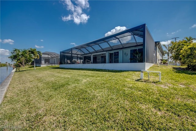 3914 SW 17th Ave, Cape Coral, FL 33914 - rear view of property featuring a lanai and a lawn