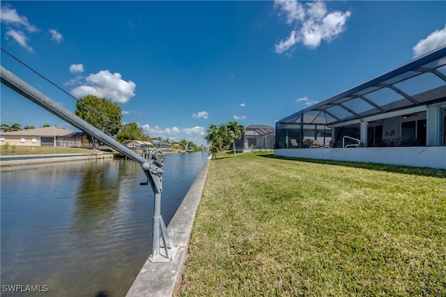 3914 SW 17th Ave, Cape Coral, FL 33914 - view of dock featuring a water view, glass enclosure, and a lawn