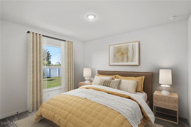 228 NW 22nd Ave, Cape Coral, FL 33993 - bedroom featuring baseboards and carpet flooring